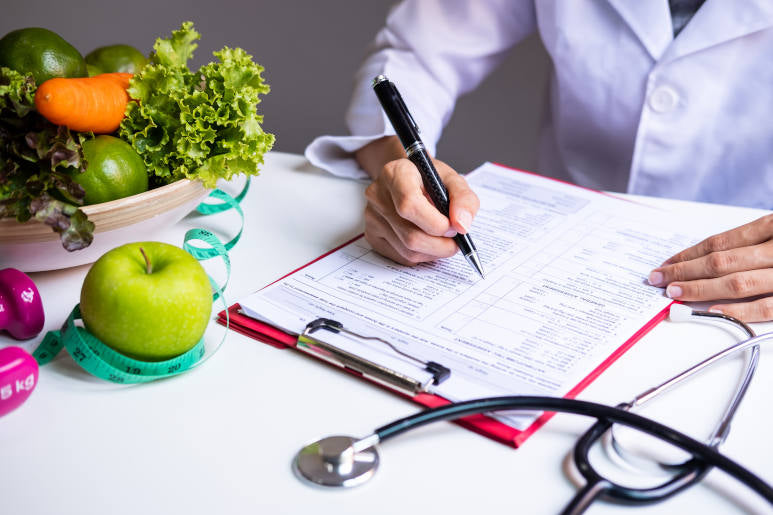 a nutritionist creating an iron rich diet plan against anaemia