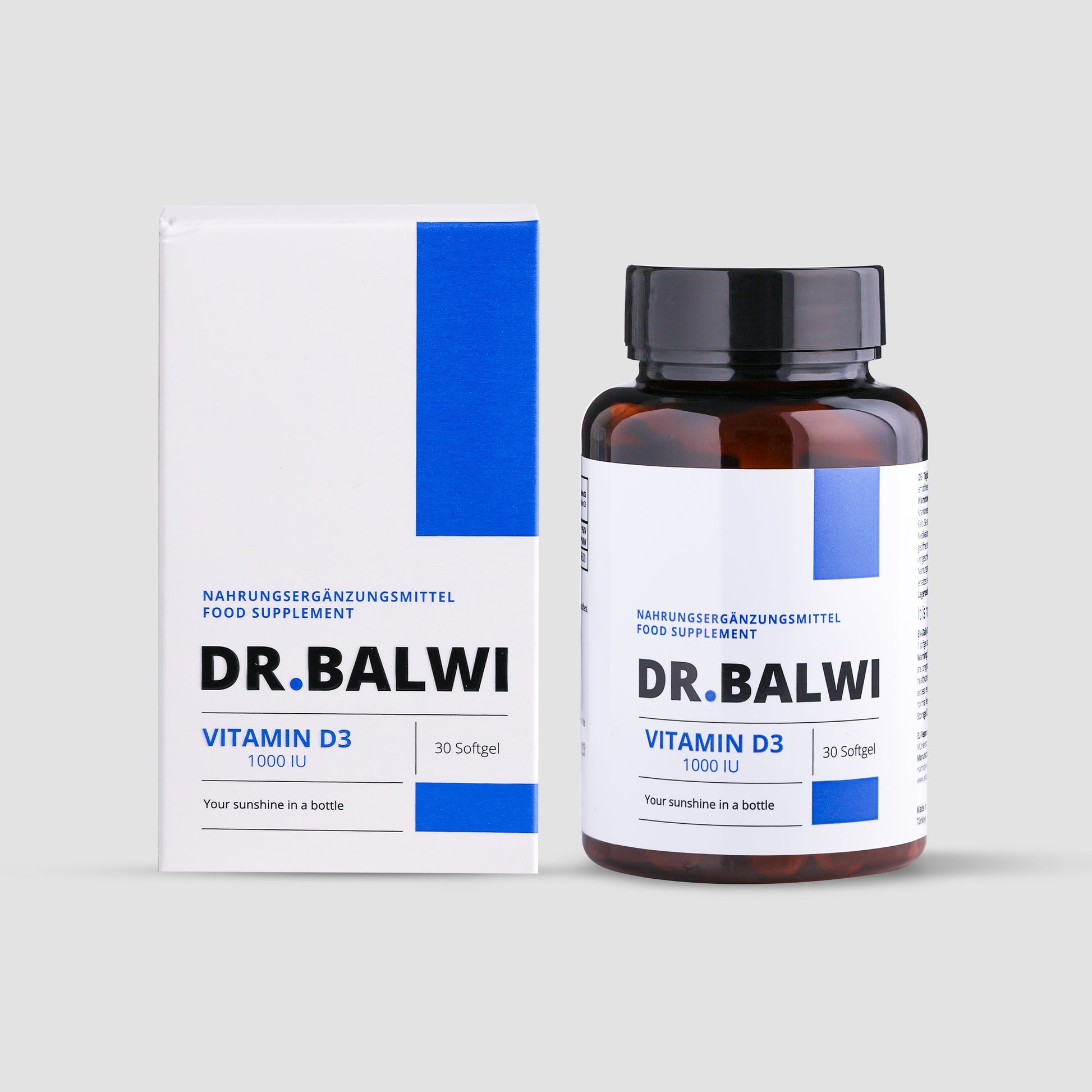 Eine Flasche und eine Schachtel shop.elithairtransplant Vitamin D 1000 IE, 30 Softgels in weißer Verpackung mit blauen und schwarzen Akzenten – unterstützt das Immunsystem und hilft, Haarausfall zu reduzieren. Ihr Sonnenschein in einer Flasche.