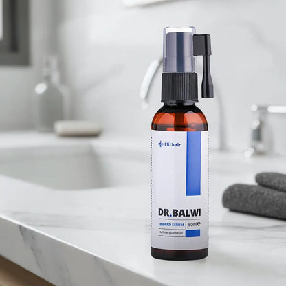 Eine Flasche Dr. Balwi Beard Serum von Dr. Balwi Shop steht auf einer Marmor-Arbeitsplatte im Badezimmer mit einem grauen Handtuch und unscharfen Accessoires im Hintergrund, die deine Bartpflege-Routine für optimalen Bartwuchs unterstützen.