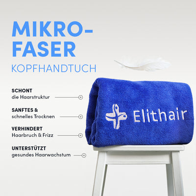 Ein Anti Haarausfall System Mikrofaser-Haartuch aus dem Dr. Balwi Shop, bestickt und blau, liegt auf einem weißen Hocker. Vorteile: Schützt die Haarstruktur, trocknet sanft und schnell, beugt Haarbruch und Kräuseln vor und unterstützt gesundes Wachstum.